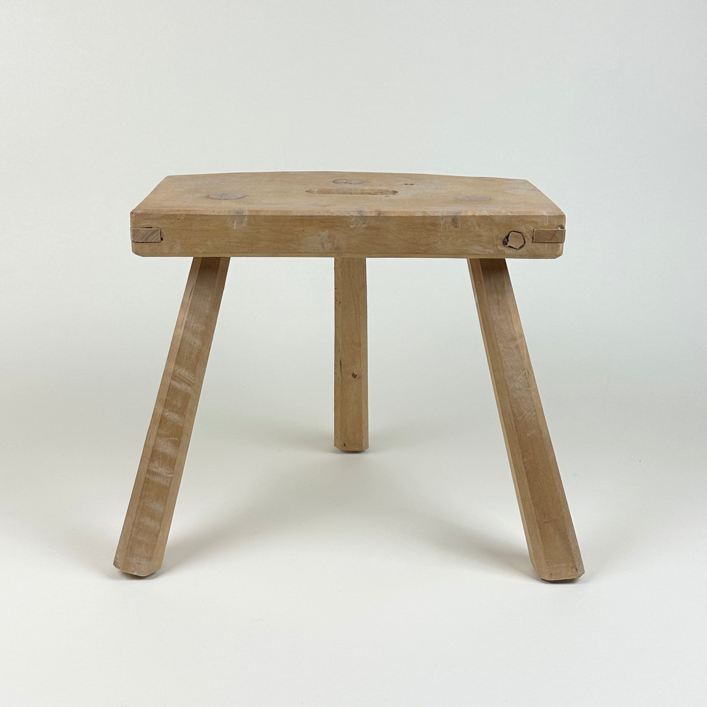 Low wooden stool, three legs, vintage