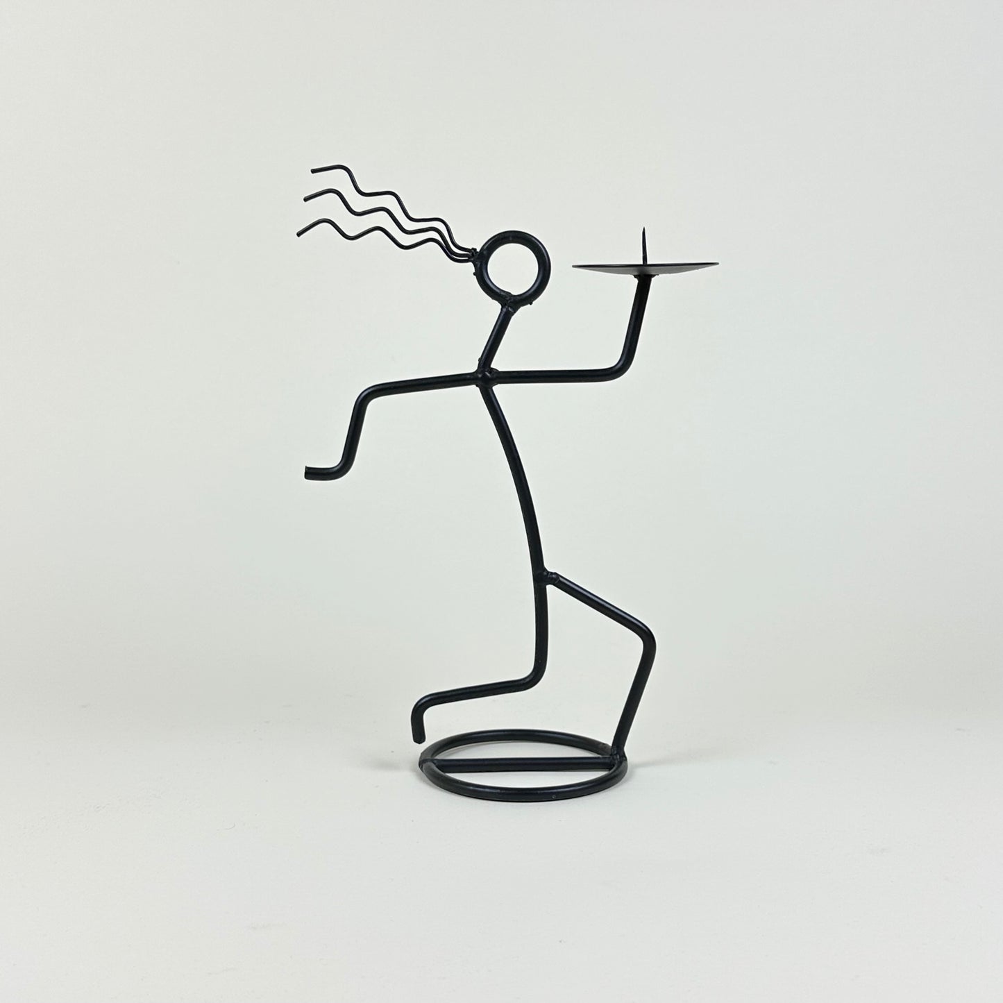 Vintage metal "on the run" candle holder