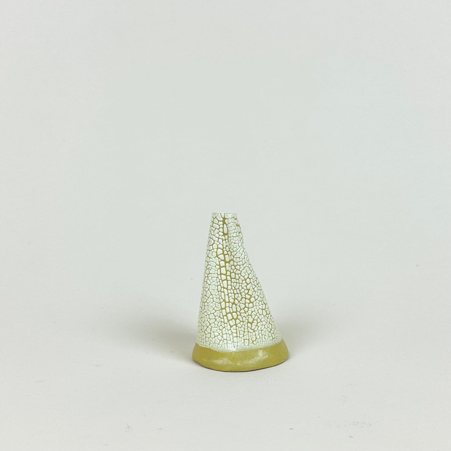 Yellow volcano vase (S) by Astrid Öhman.