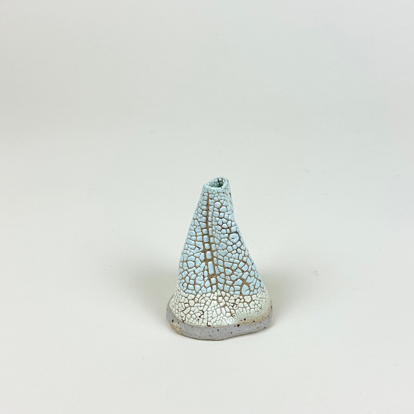 Light blue and yellow volcano vase (S) by Astrid Öhman.