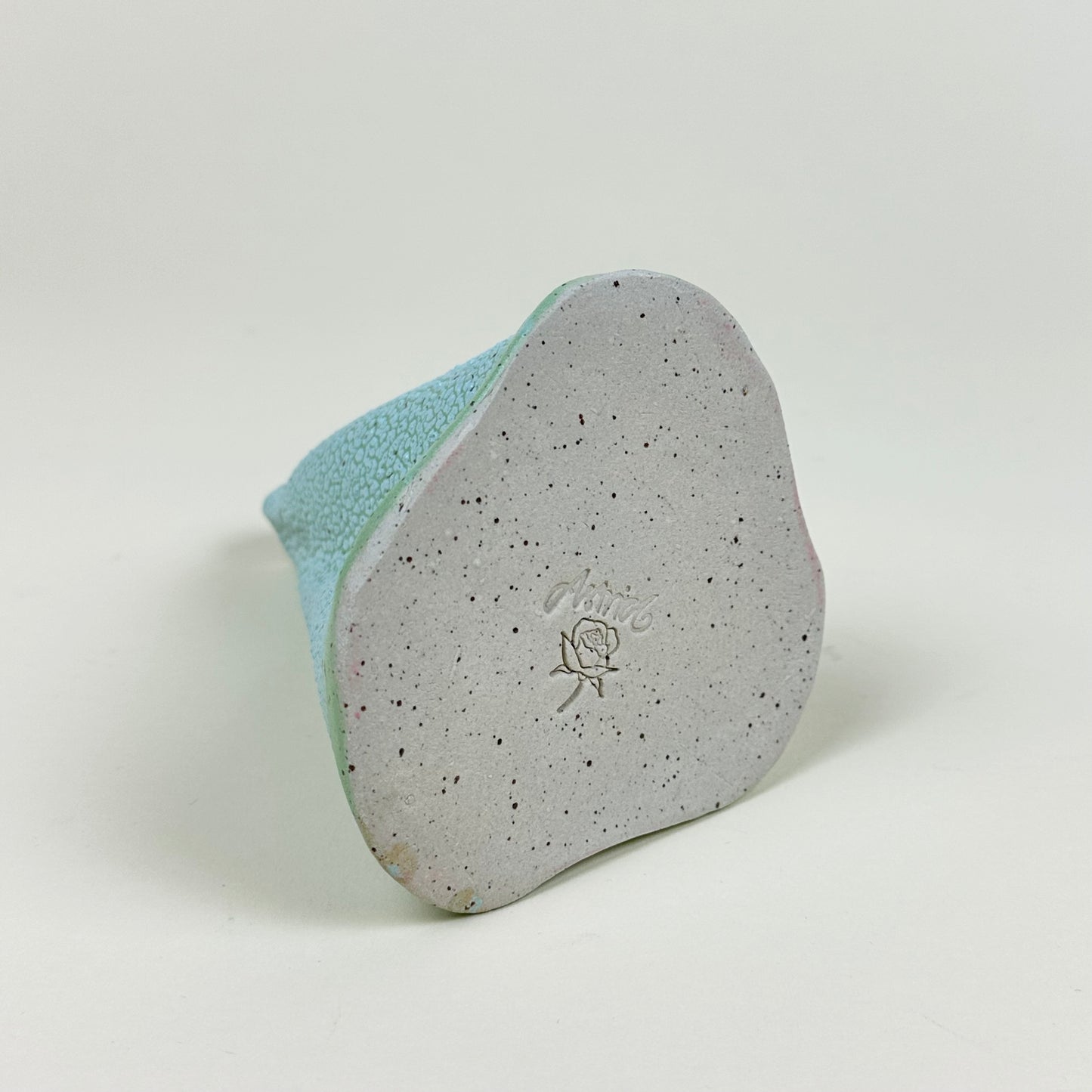 Turquoise and aqua volcano vase (L) by Astrid Öhman.