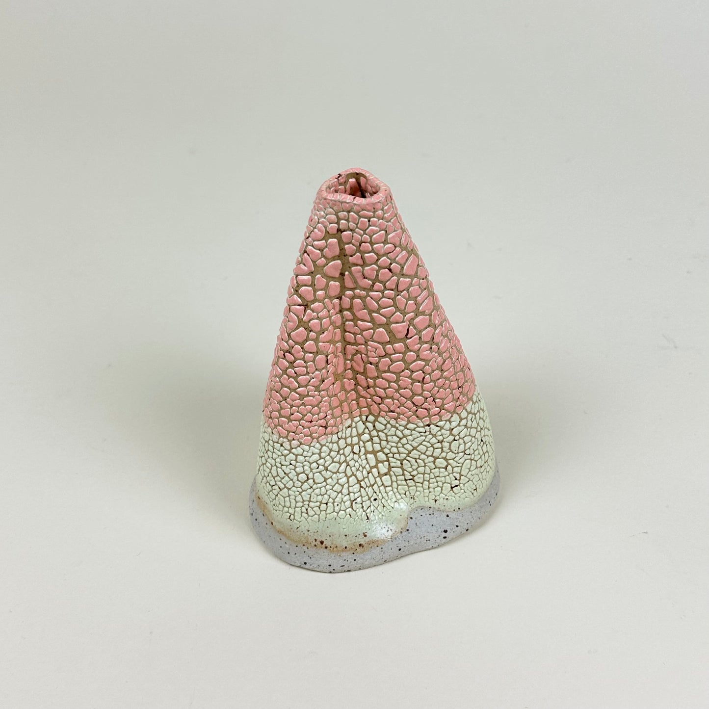 Pink and light yellow volcano vase (L) by Astrid Öhman.
