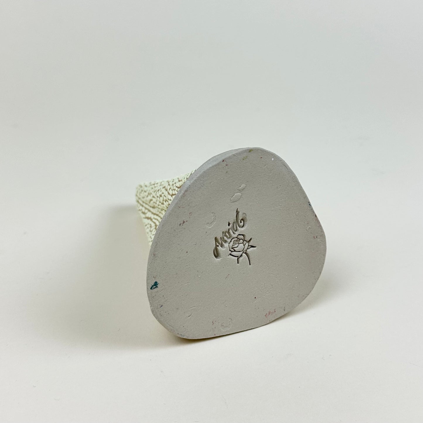 Light yellow volcano vase (L) by Astrid Öhman.