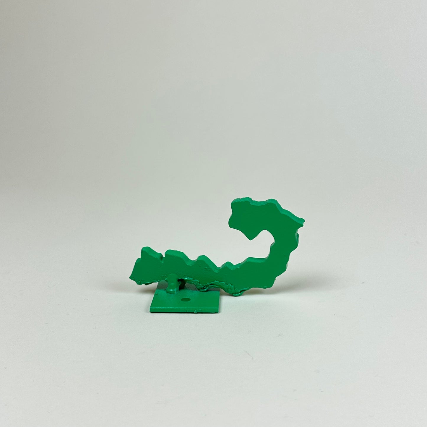 Green metal wall hook by Lisa Reiser