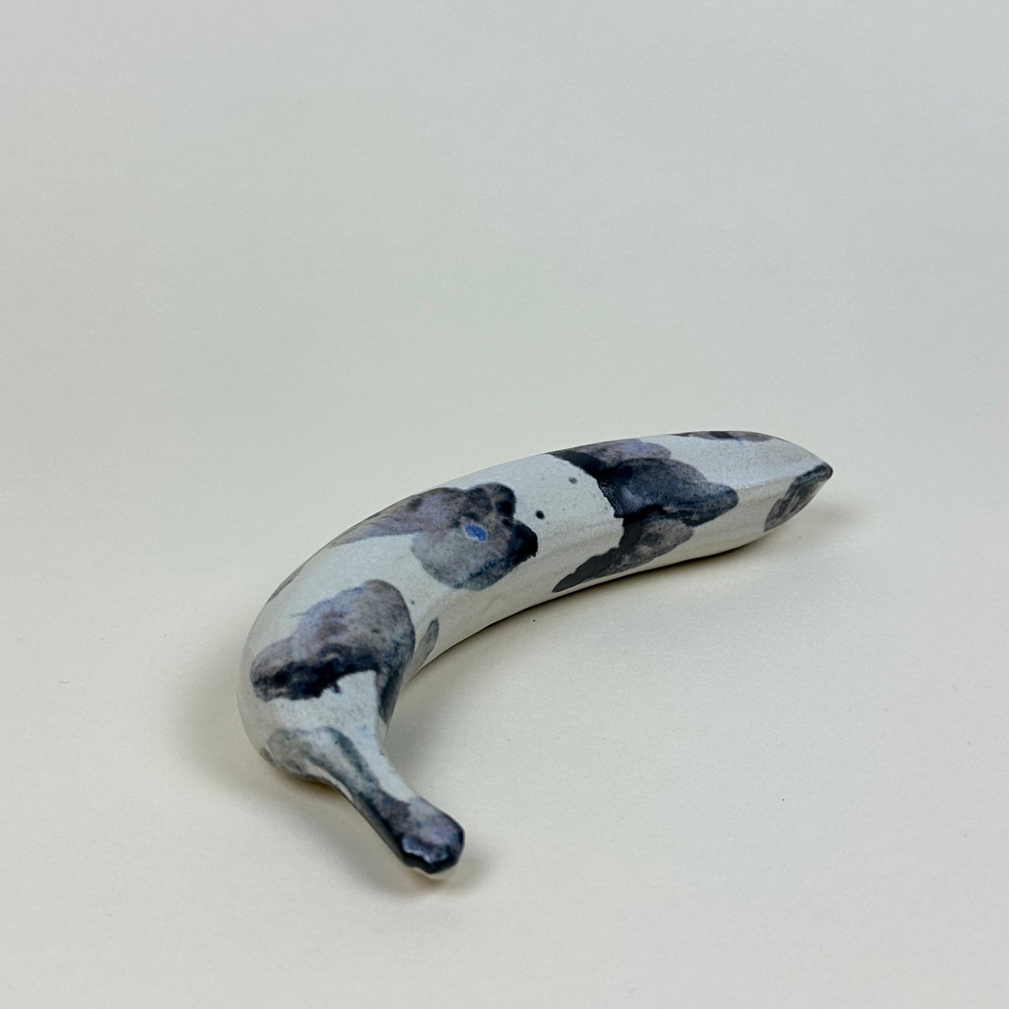 Spotted blue and white stoneware banana by Malwina Kleparska