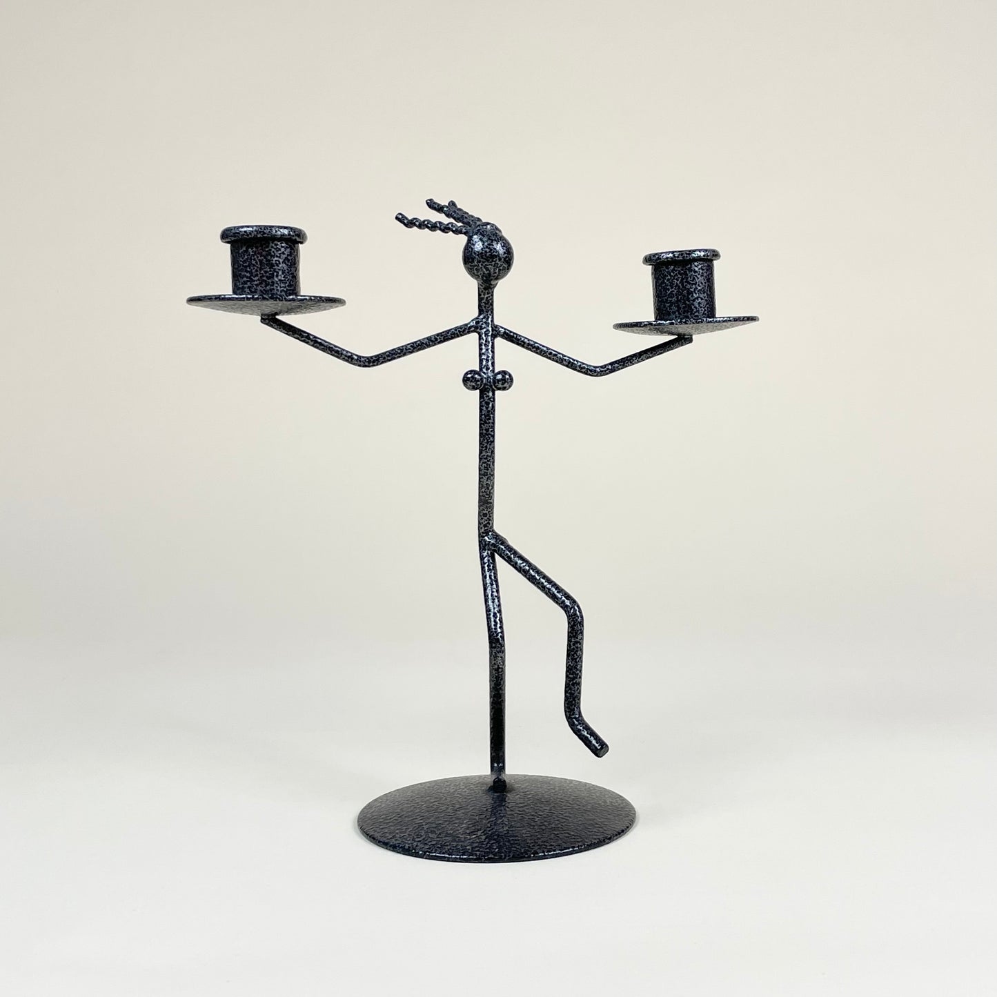 Vintage metal candle holder in the shape of a woman