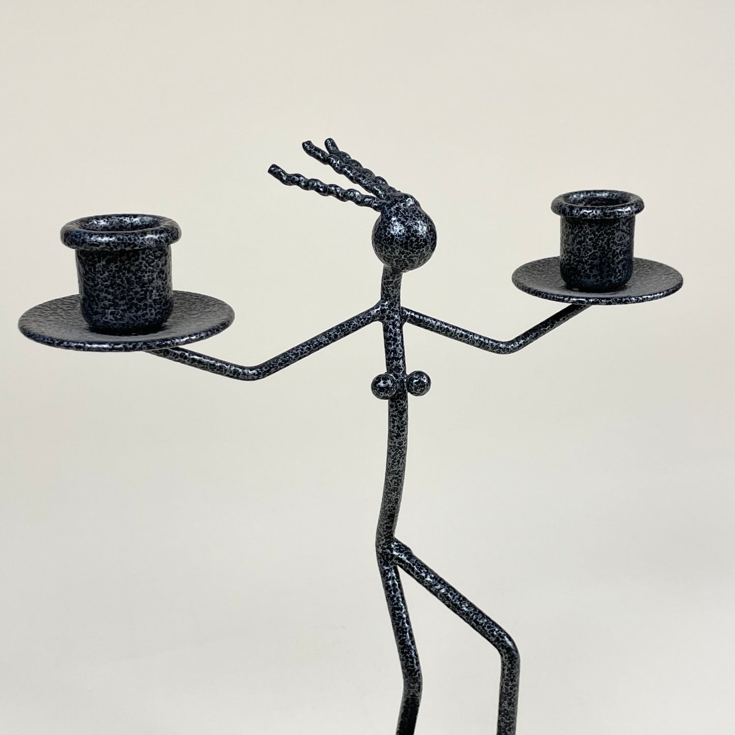 Vintage metal candle holder in the shape of a woman