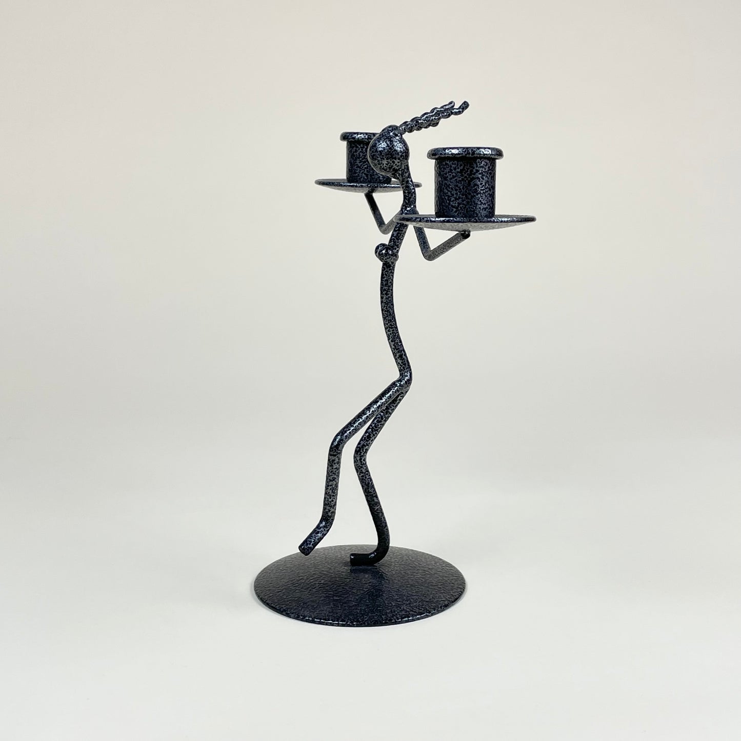 Vintage metal candle holder in the shape of a woman