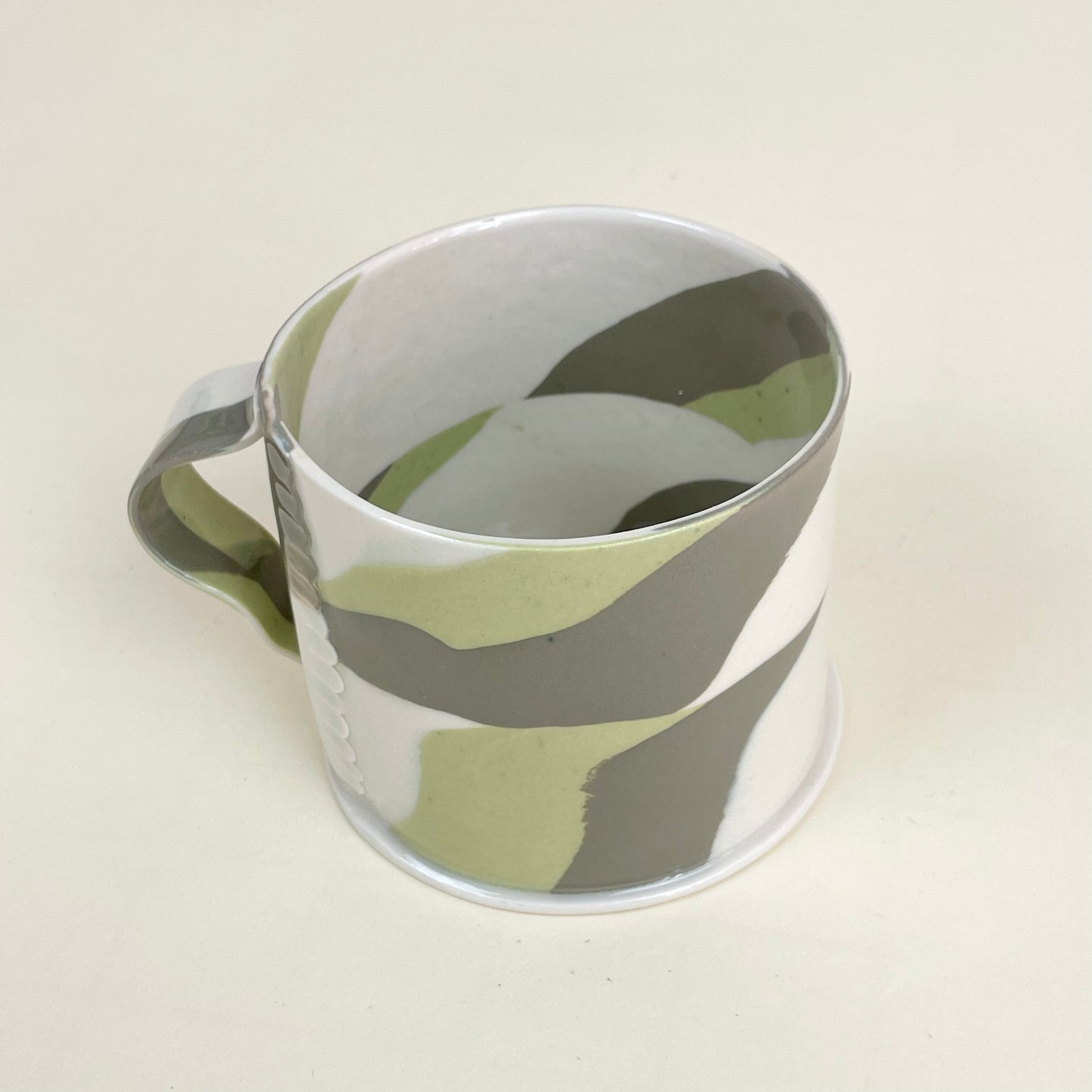 Ceramic mug by Emma Berzén (cream and greens)
