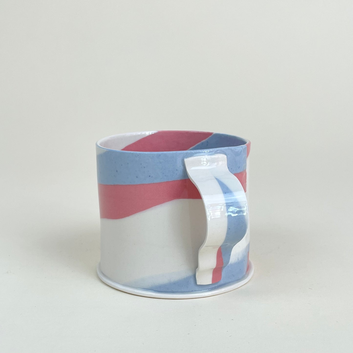 Ceramic mug by Emma Berzén (cream blue red)