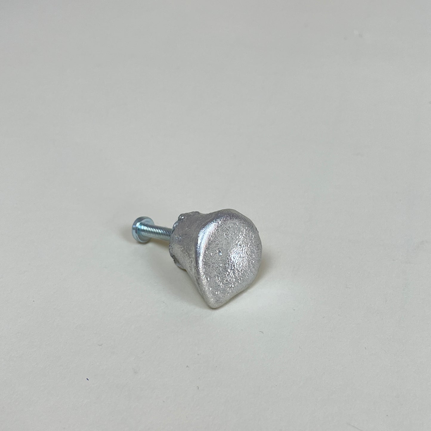 Tin door knob by Alfred Sahlén