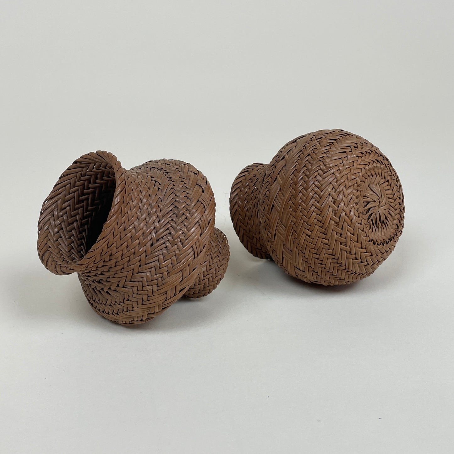Vintage pair of miniature rattan baskets