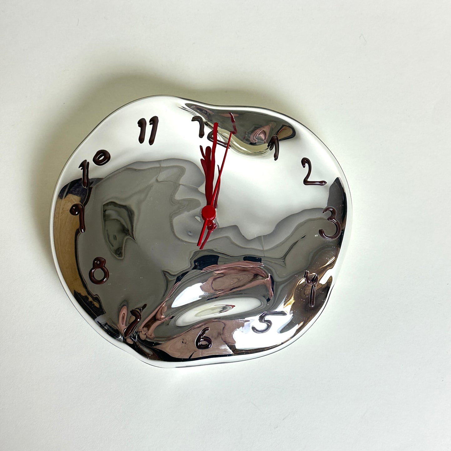 Silvered glass clock by Silje Lindrup