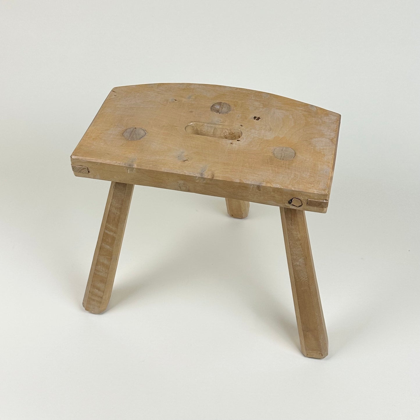 Low wooden stool, three legs, vintage