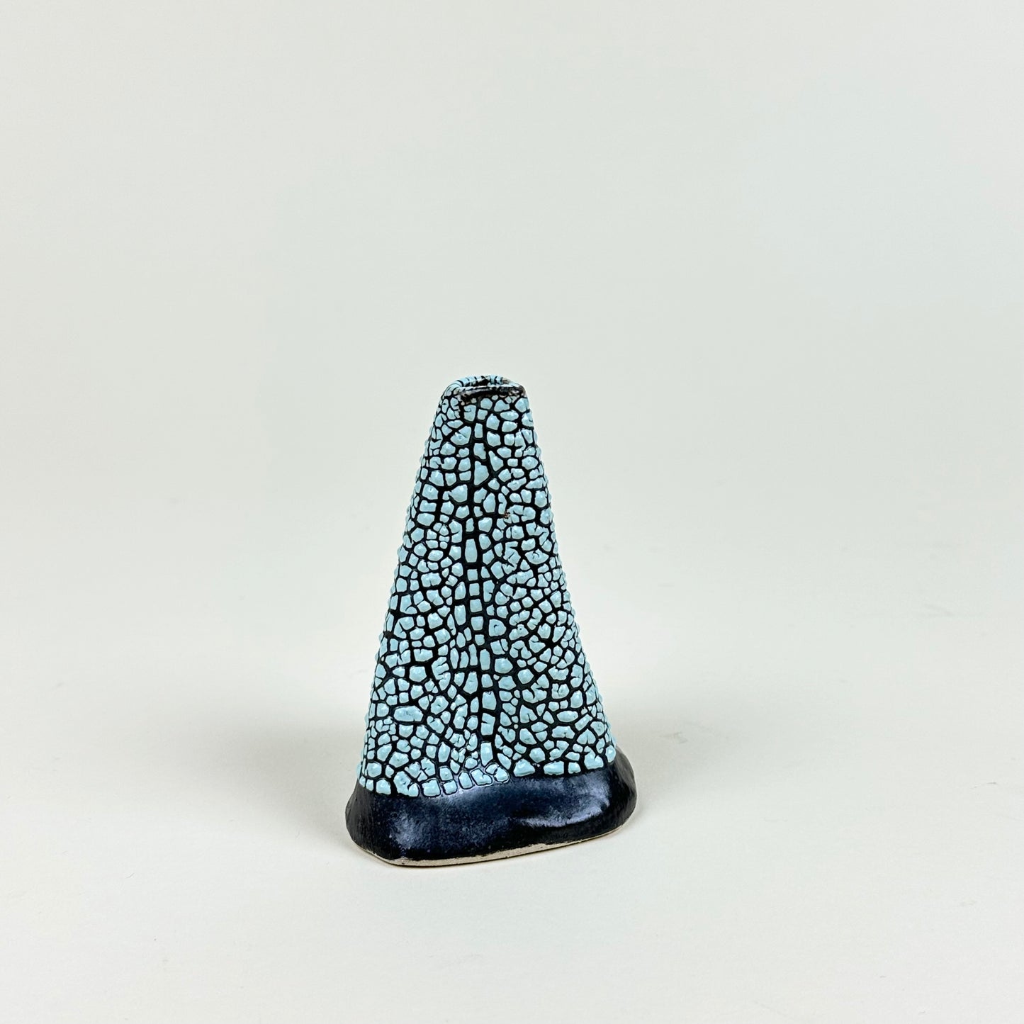 Black and turquoise volcano vase (S) by Astrid Öhman.