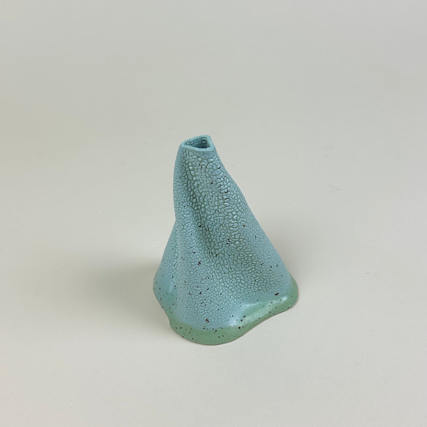 Turquoise and aqua volcano vase (L) by Astrid Öhman.