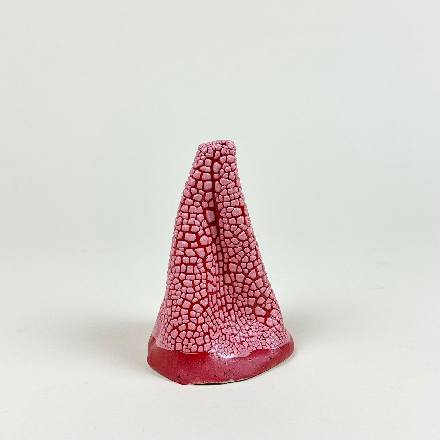 Red and pink volcano vase (L) by Astrid Öhman.