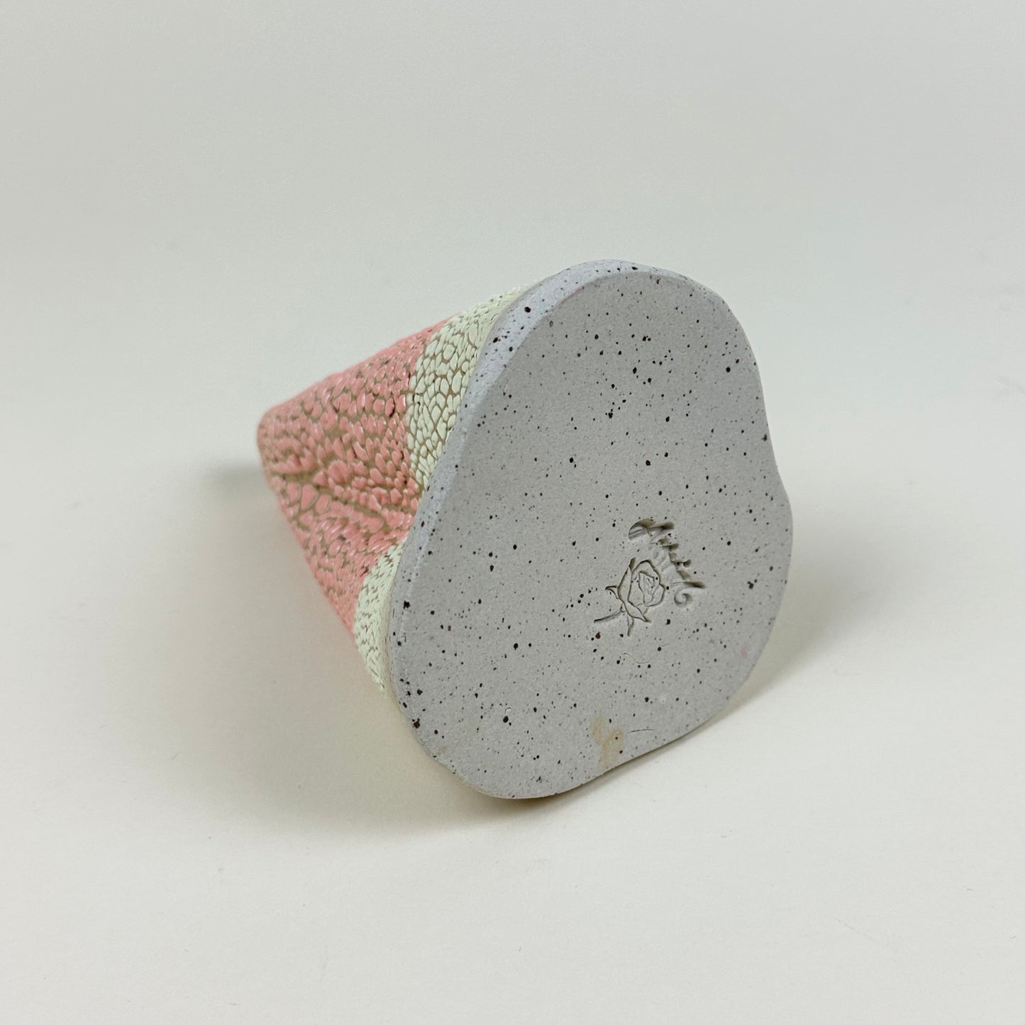 Pink and light yellow volcano vase (L) by Astrid Öhman.