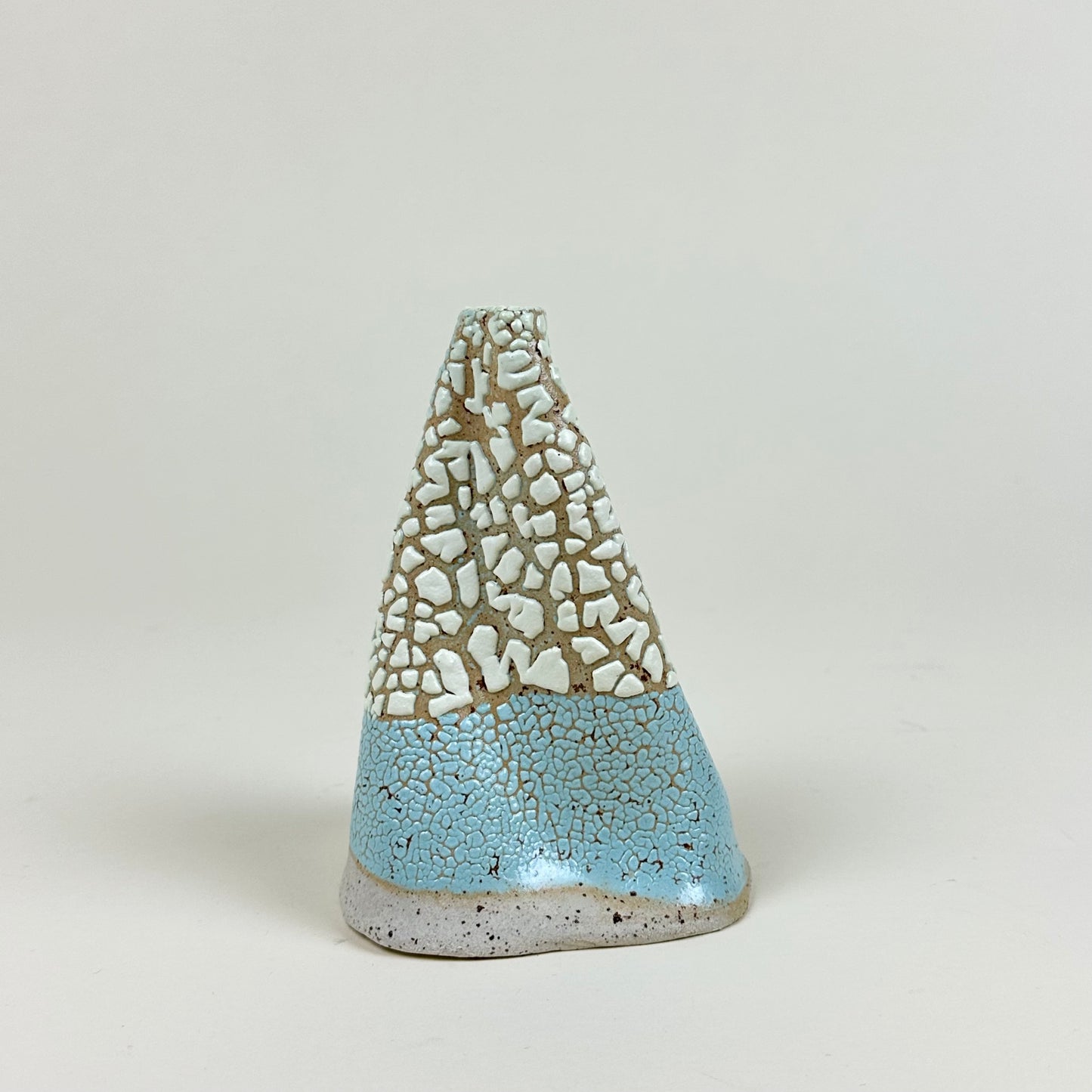 Light yellow and blue yellow volcano vase (L) by Astrid Öhman.