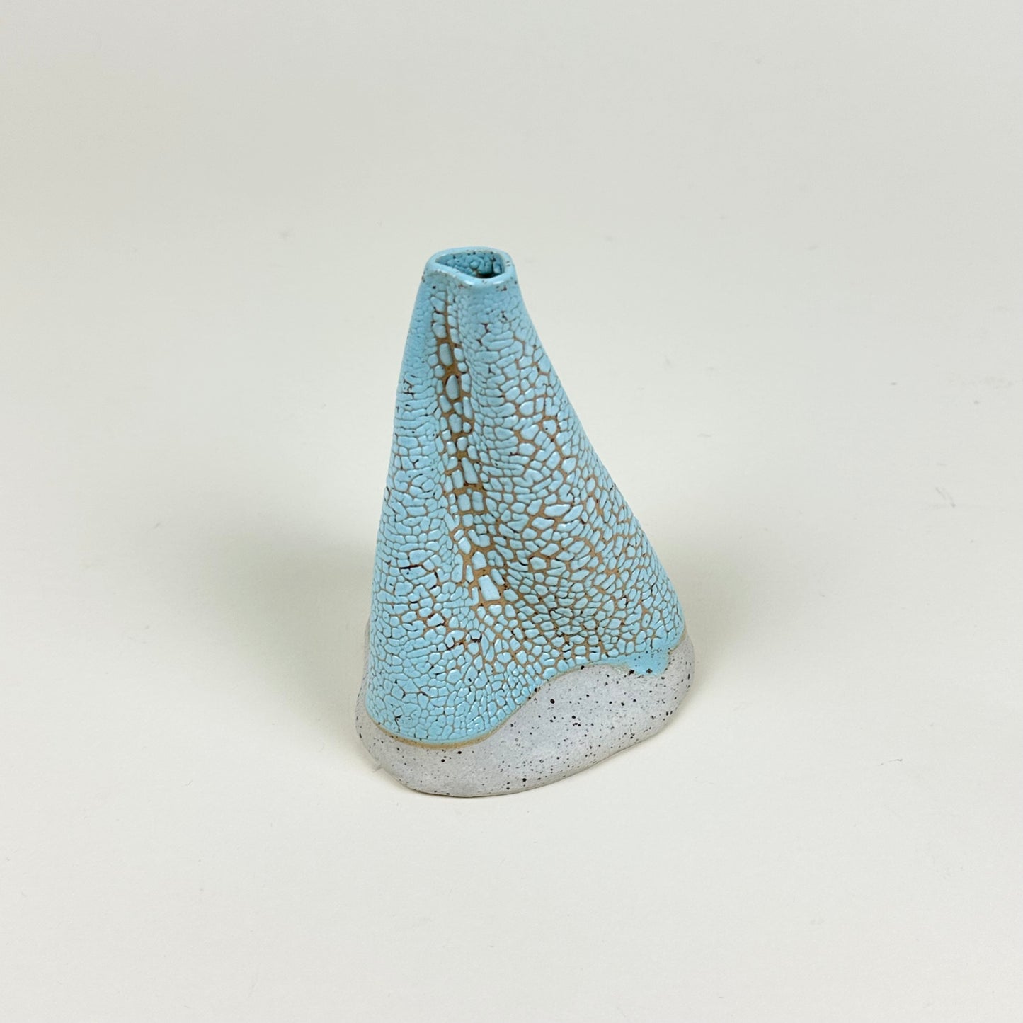 Light blue yellow volcano vase (L) by Astrid Öhman.