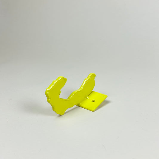 Yellow metal wall hook by Lisa Reiser