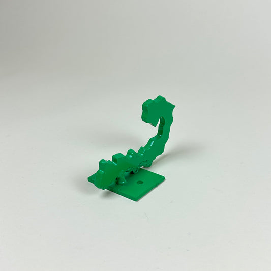 Green metal wall hook by Lisa Reiser