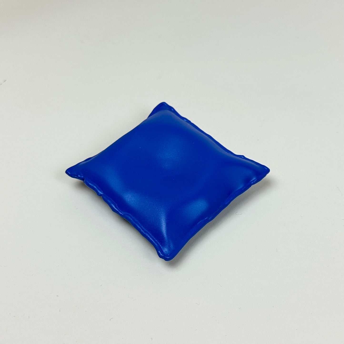 Blue aluminum pillow bowl by Emma Stocklassa