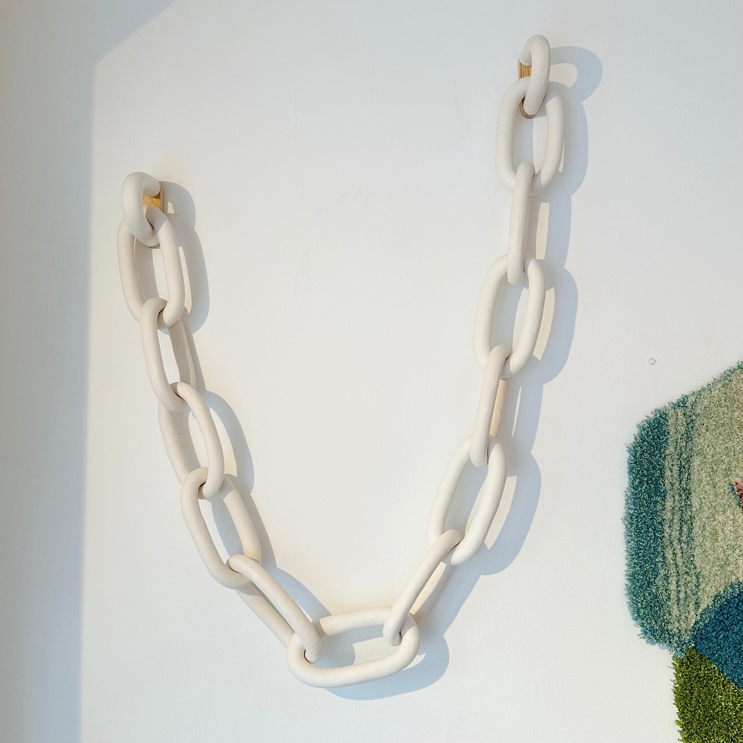 Chain (wall mounted), 12 links, by Kerstin Olsson