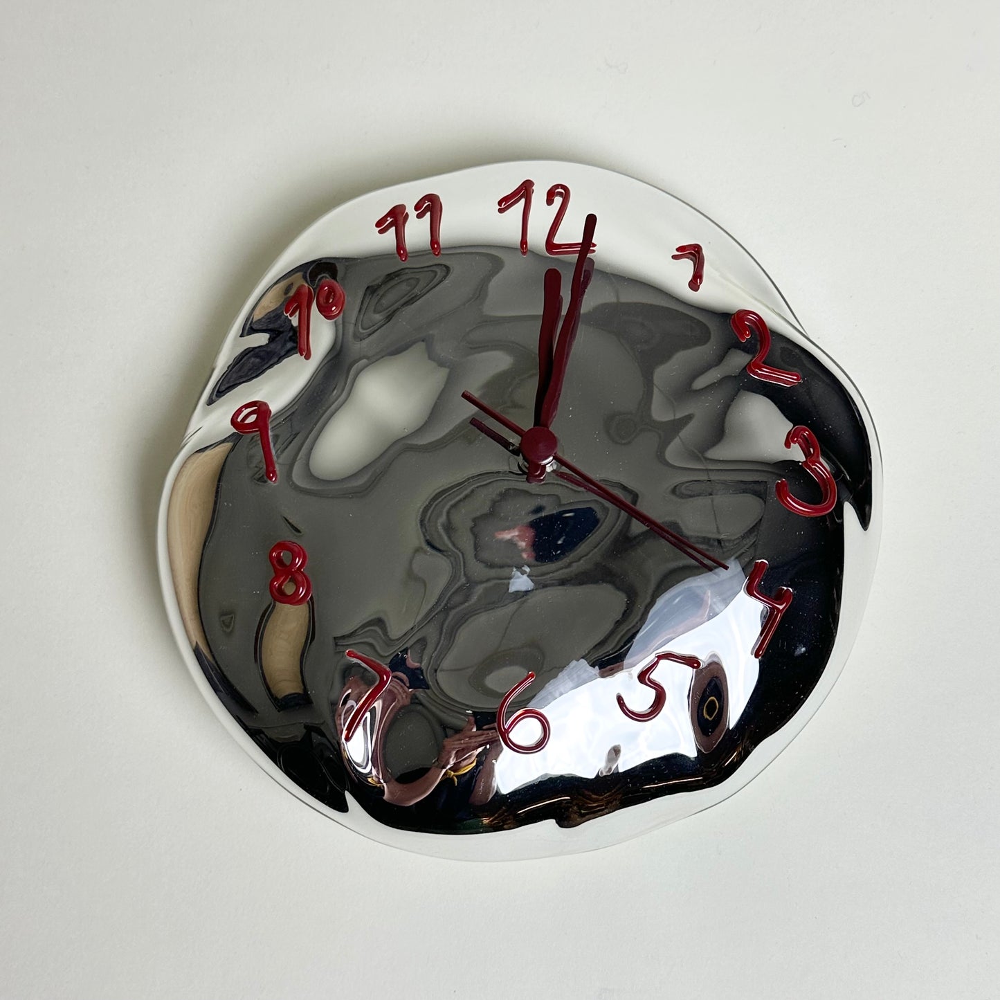 Silvered glass clock by Silje Lindrup