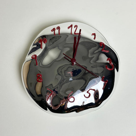 Silvered glass clock by Silje Lindrup