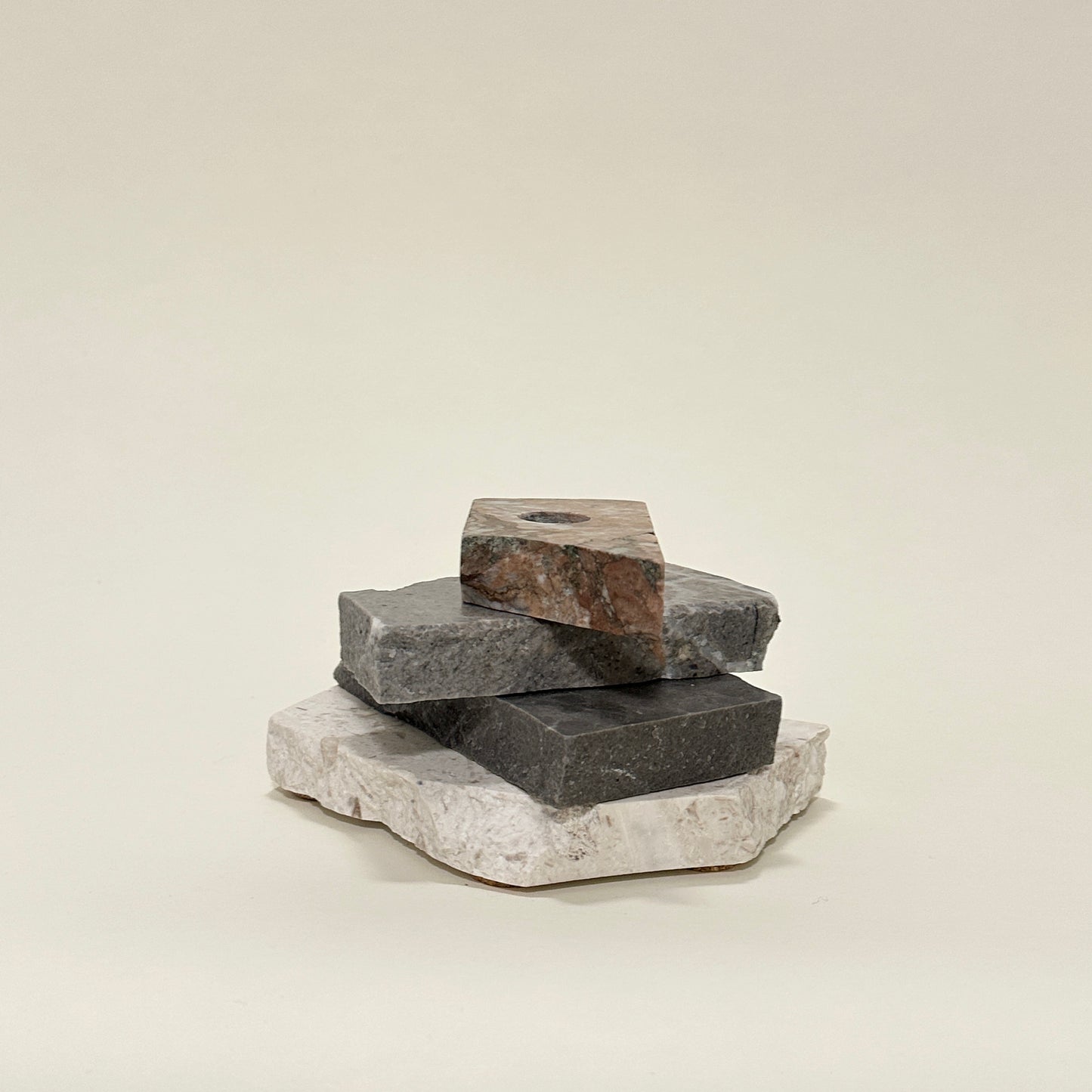 Candle holder in mixed marble by Public Studio