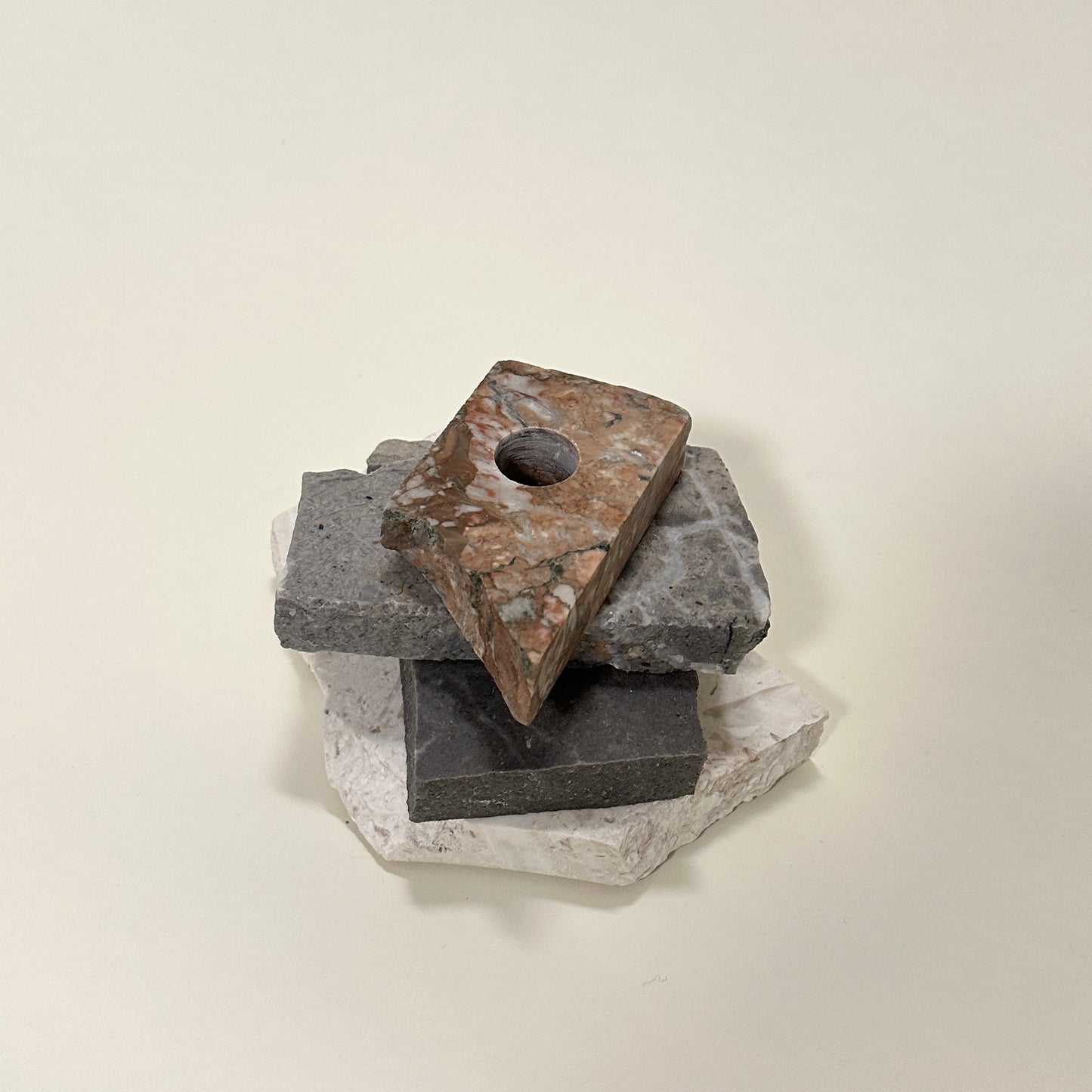 Candle holder in mixed marble by Public Studio