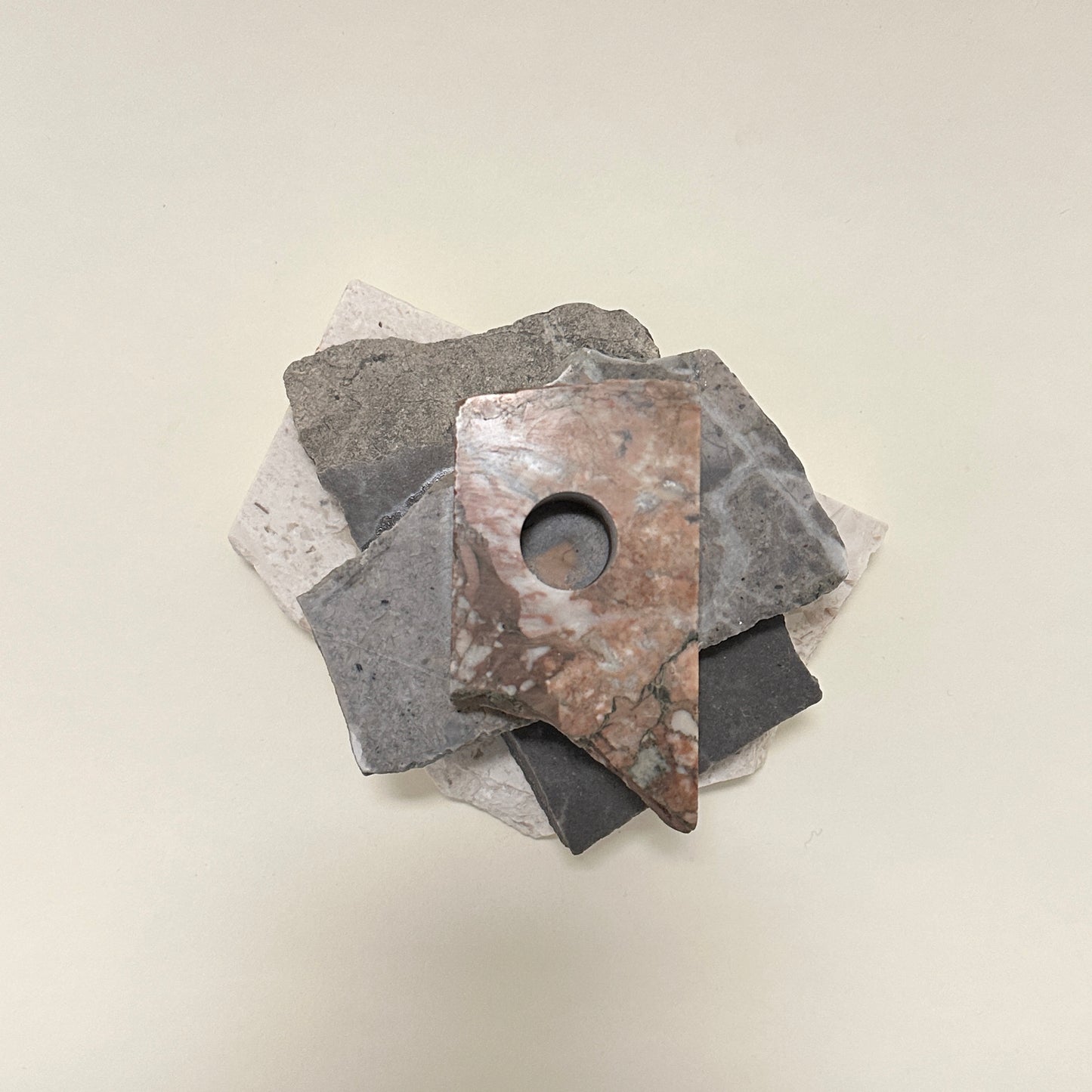 Candle holder in mixed marble by Public Studio