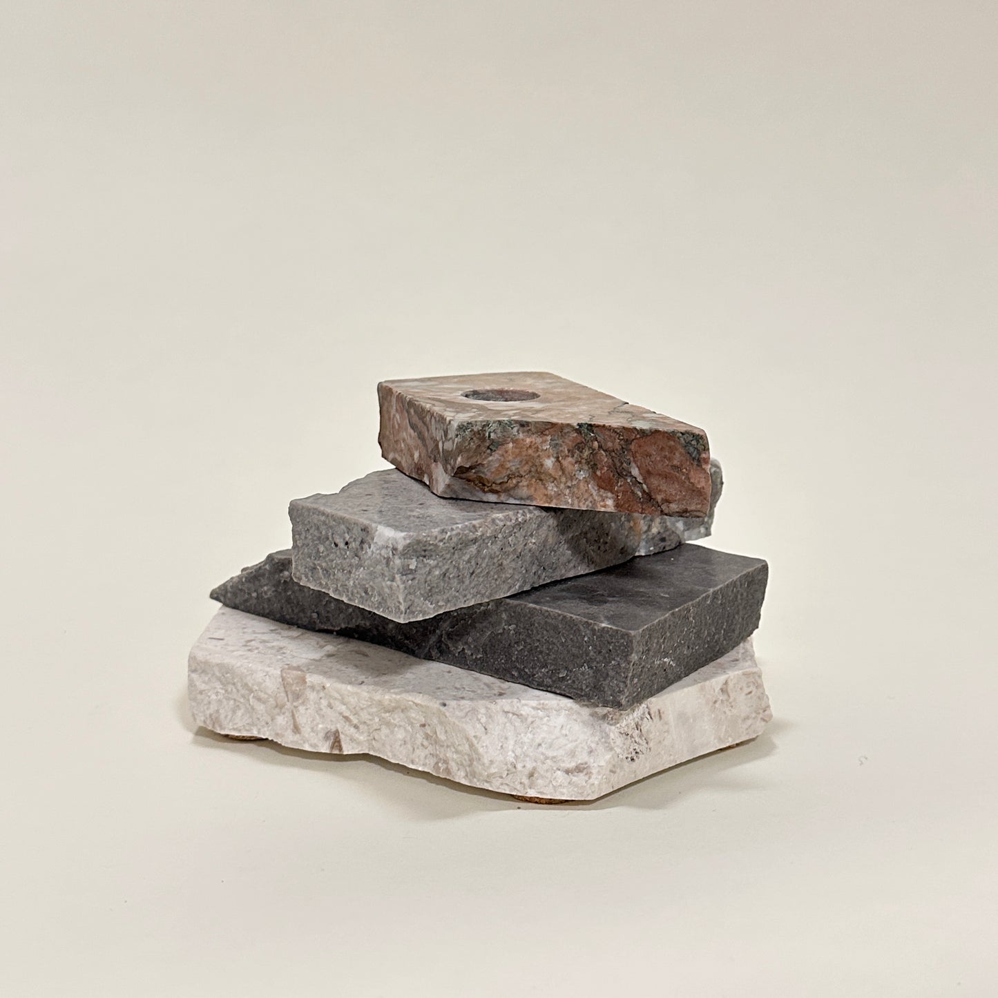 Candle holder in mixed marble by Public Studio