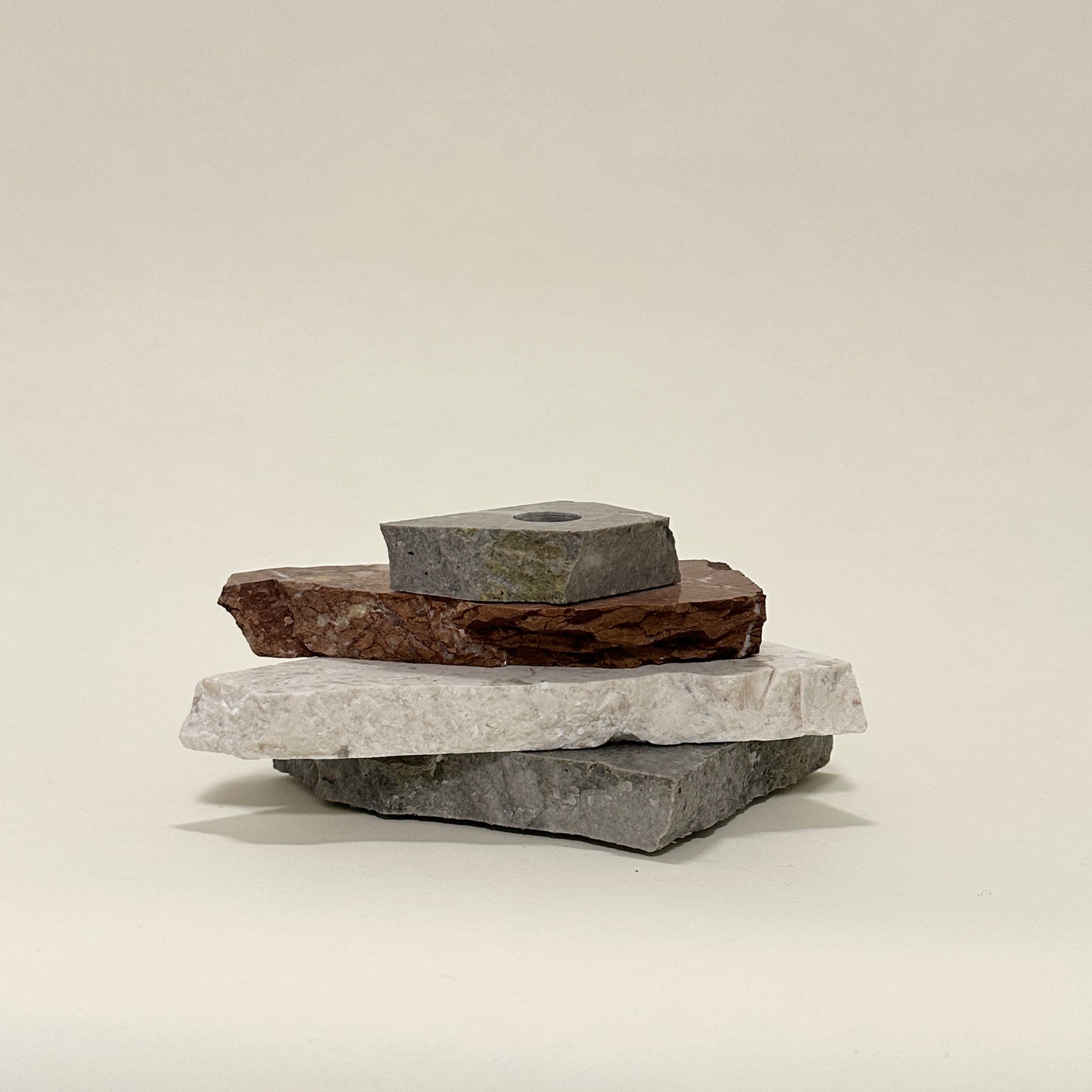 Candle holder in mixed marble by Public Studio