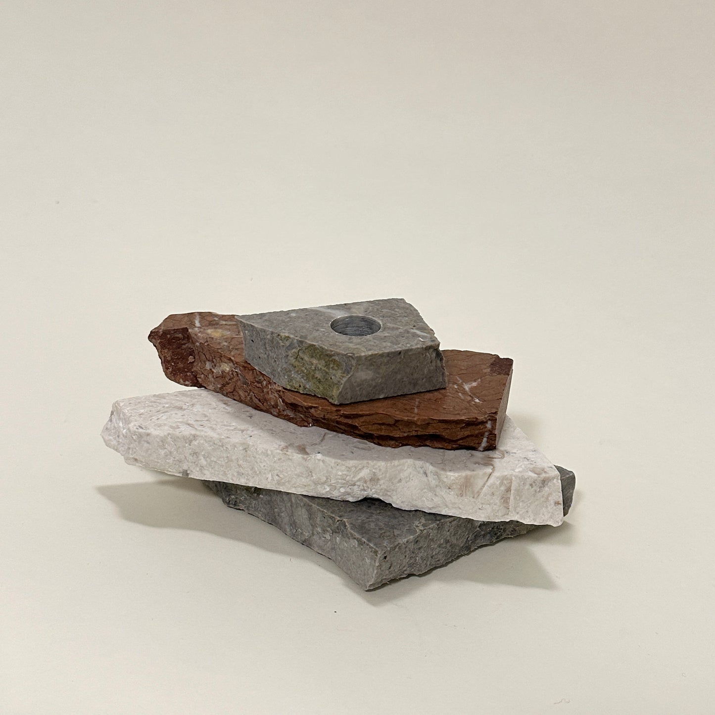 Candle holder in mixed marble by Public Studio