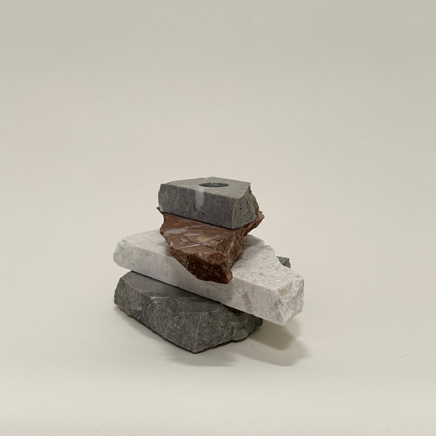 Candle holder in mixed marble by Public Studio