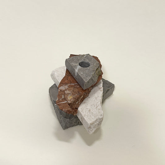 Candle holder in mixed marble by Public Studio