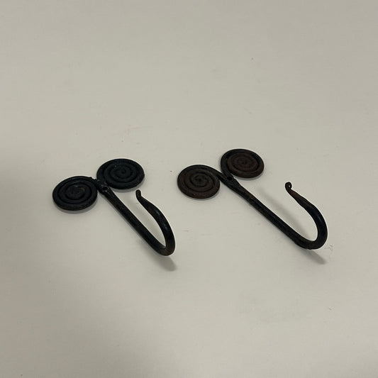 Pair of black metal wall hooks, vintage