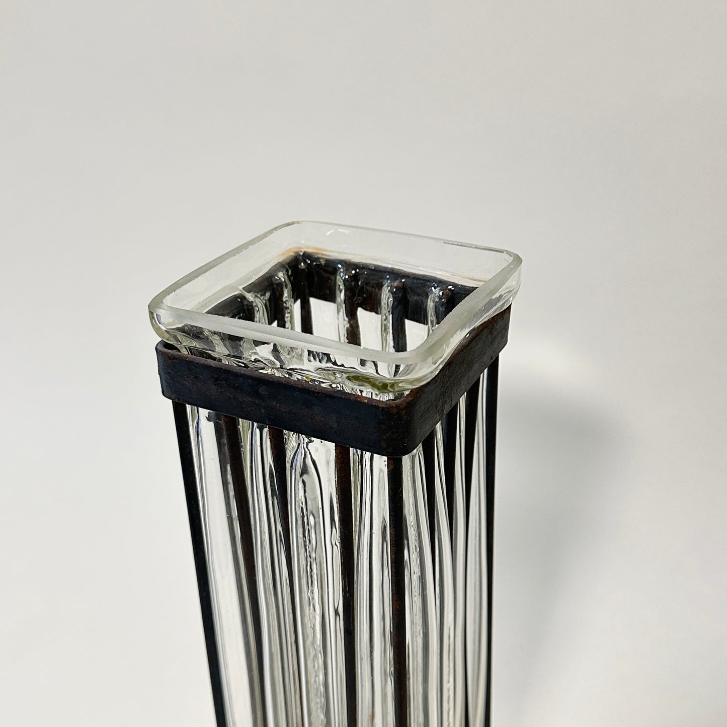 Vintage glass vase with metal cast