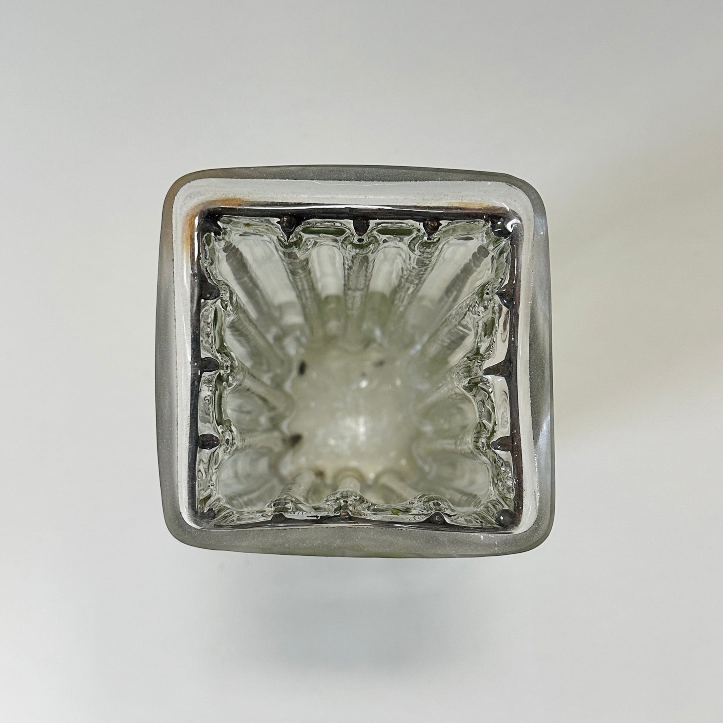 Vintage glass vase with metal cast