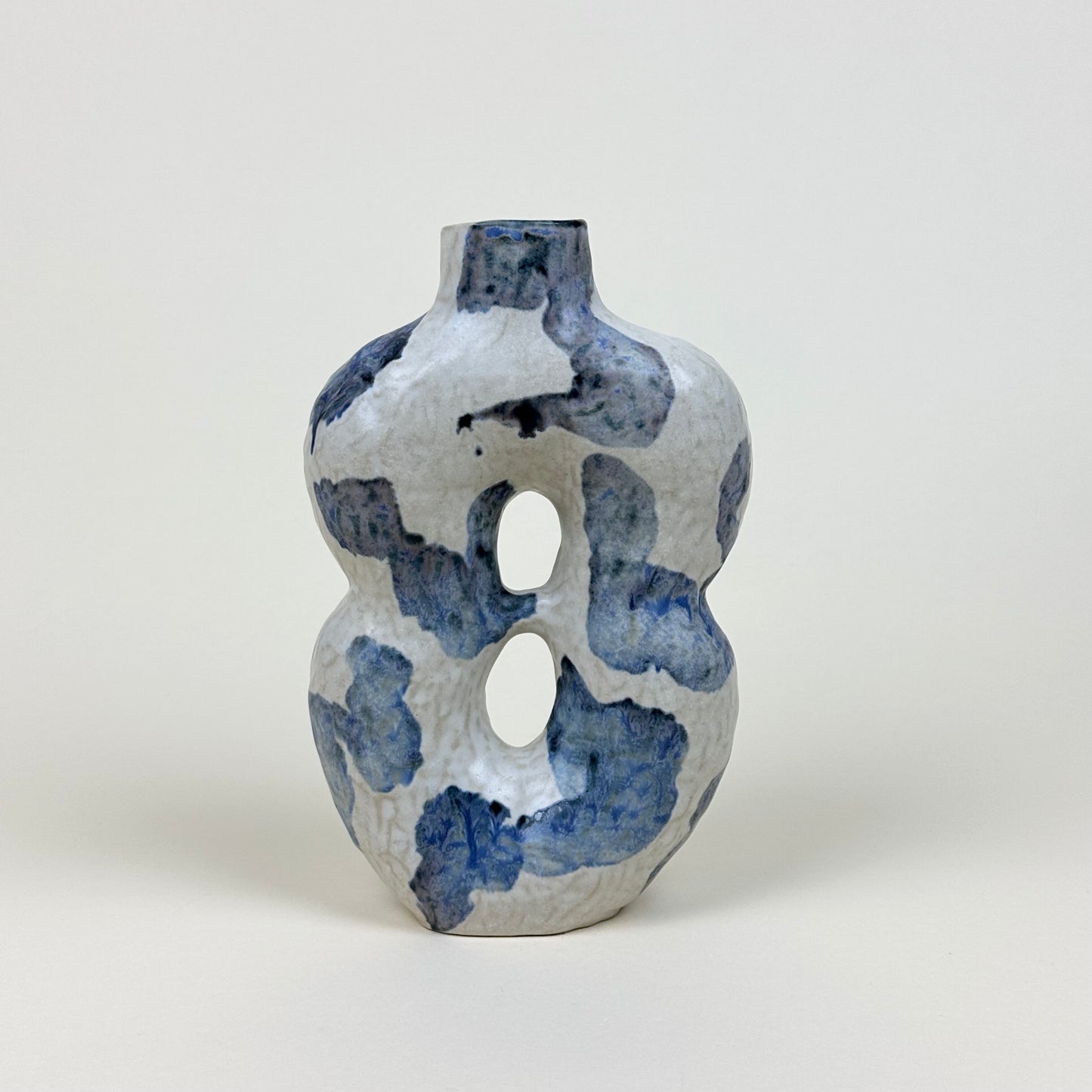 White and blue stoneware vase with two holes by Malwina Kleparska