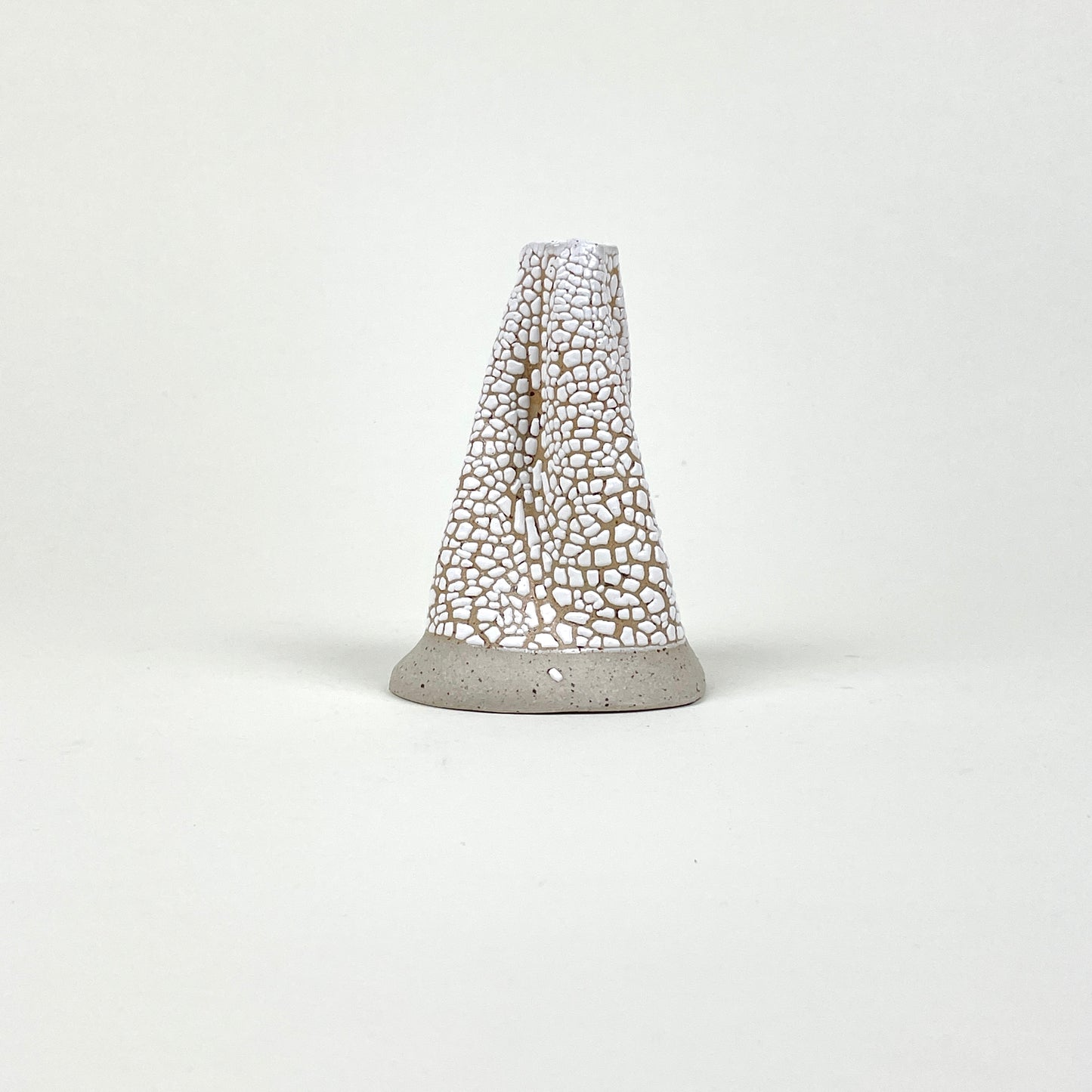 Beige white volcano vase (L) by Astrid Öhman.