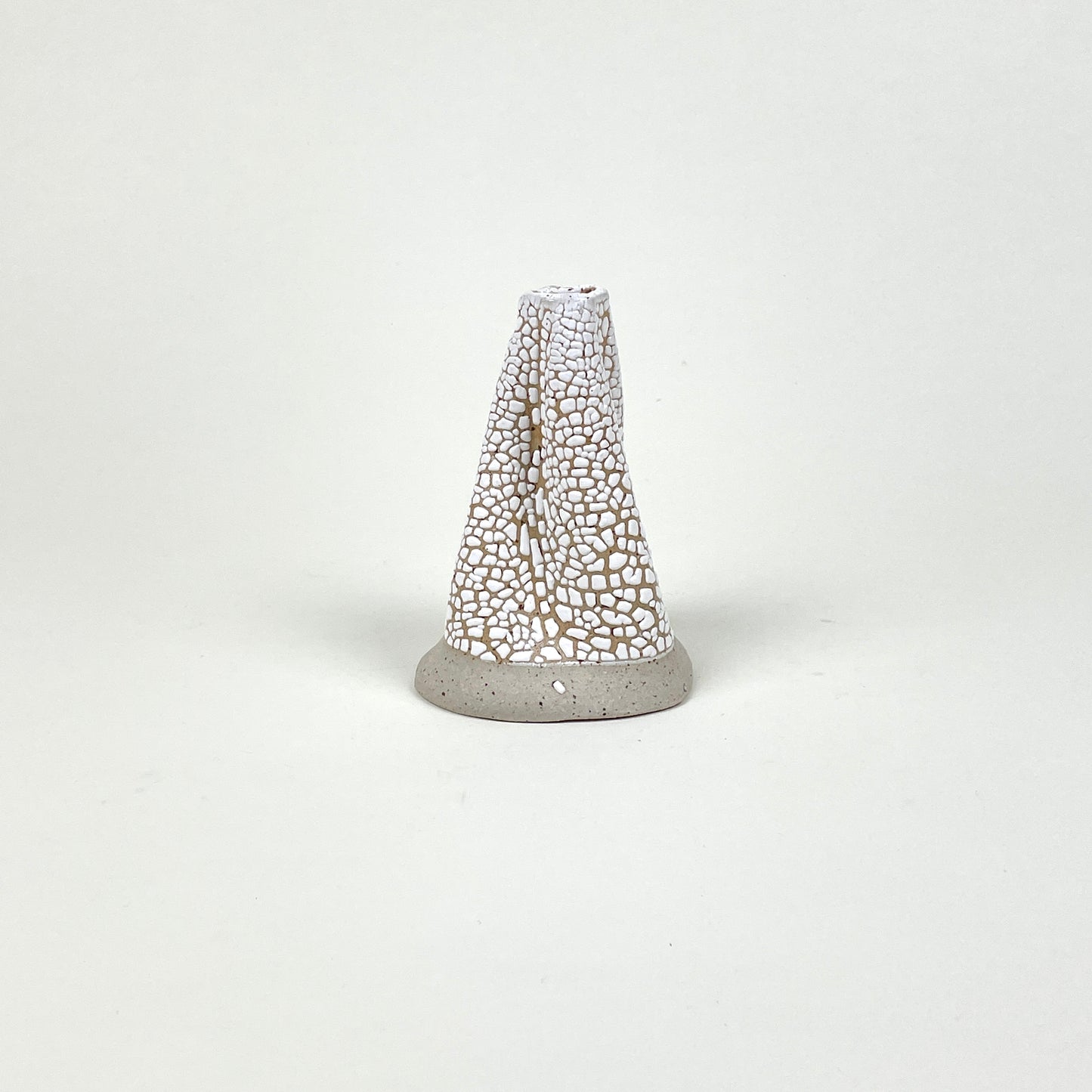 Beige white volcano vase (L) by Astrid Öhman.