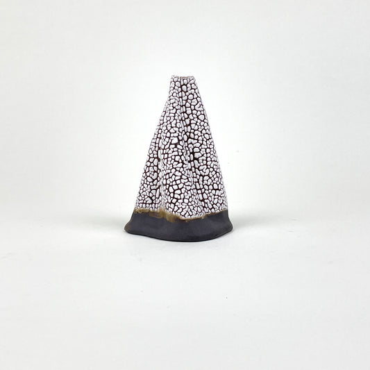Dark brown and white volcano vase (L) by Astrid Öhman.
