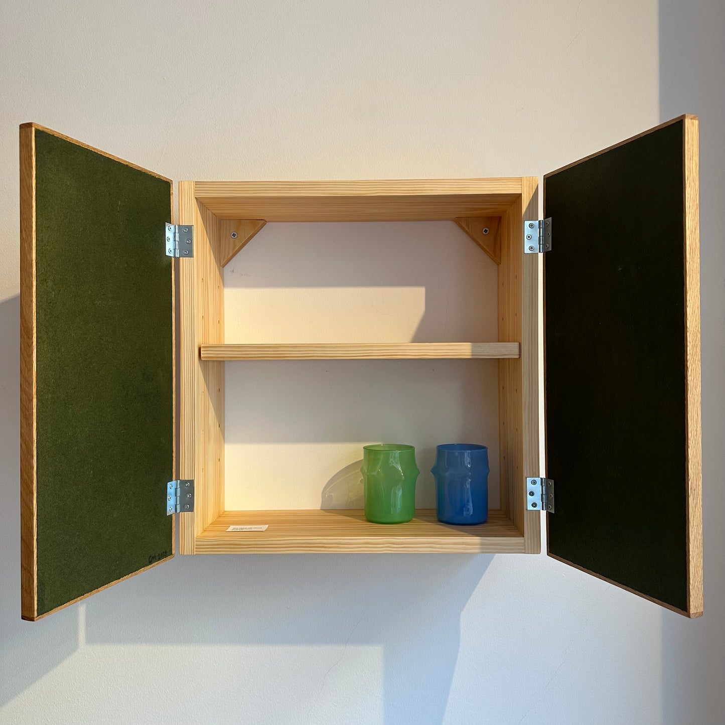 Intarsia wall cabinet by Carl Martinson