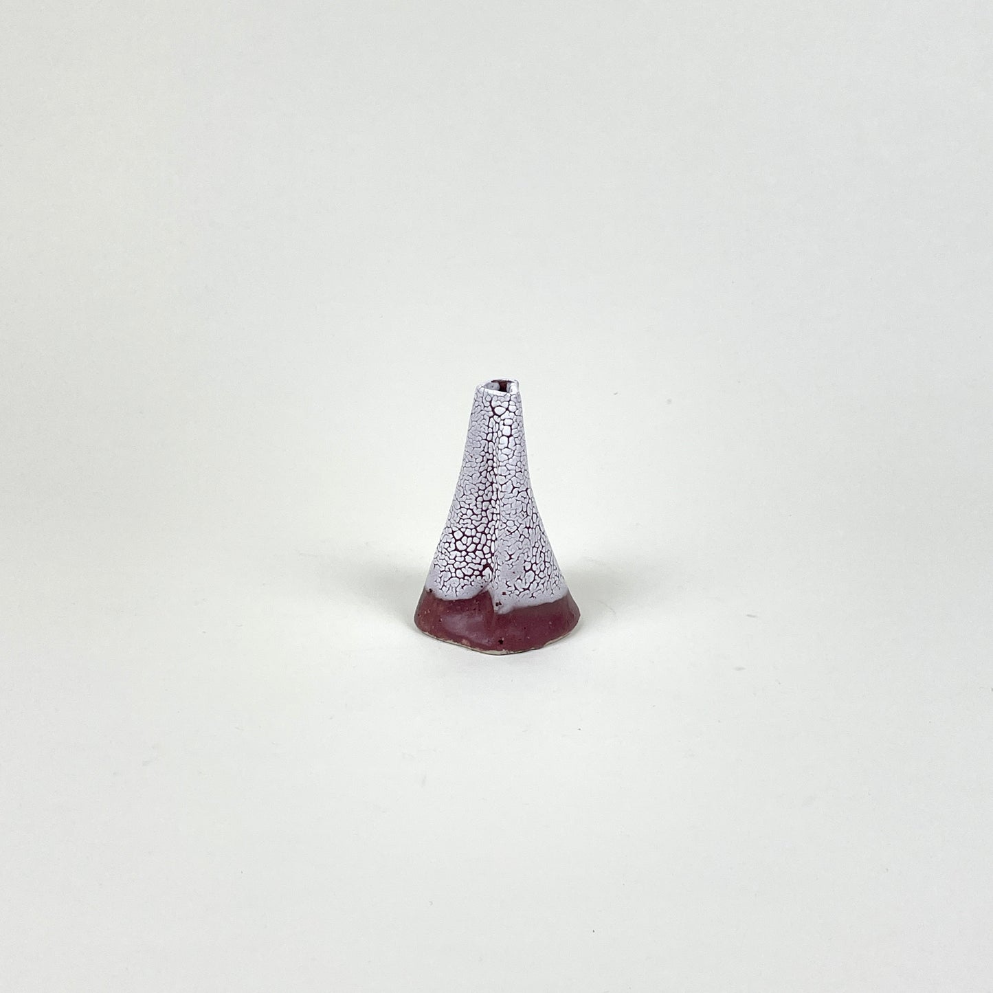Burgundy and white volcano vase (S) by Astrid Öhman.