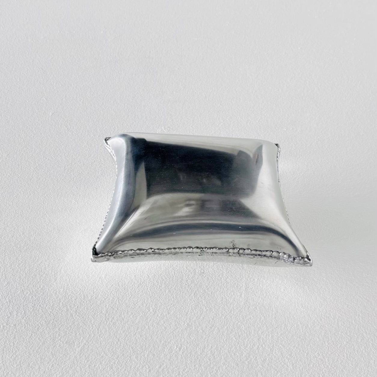 Aluminum Pillow by Emma Stocklassa