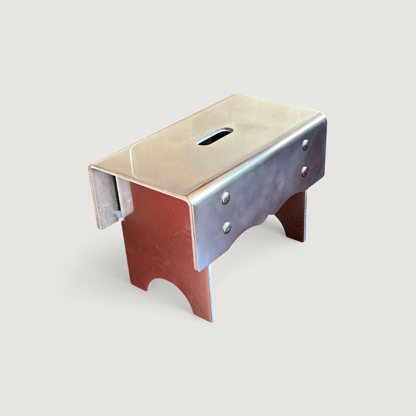 "Alumoge" milk stool in aluminum by Anna Levander