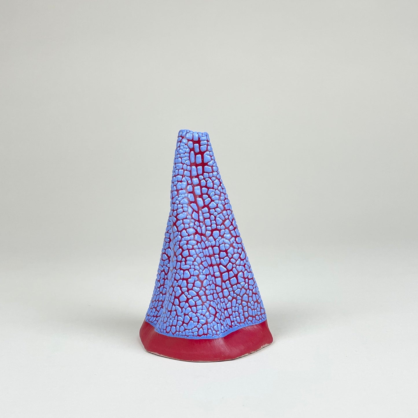 Red and blue volcano vase (L) by Astrid Öhman.